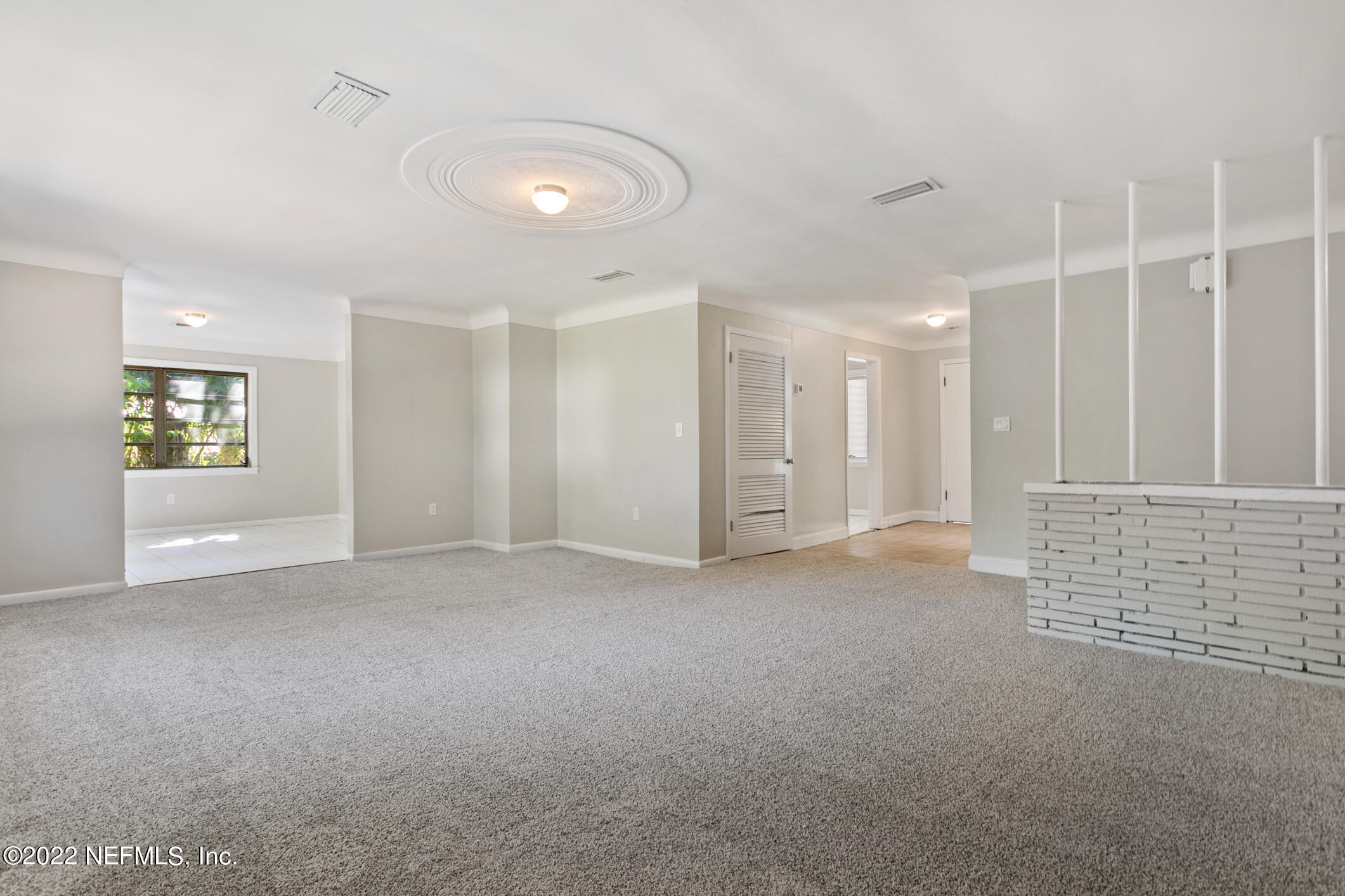 97 Spring Street St. Augustine, FL 32084 - Photo 6 of 18 a view of an empty room with a window