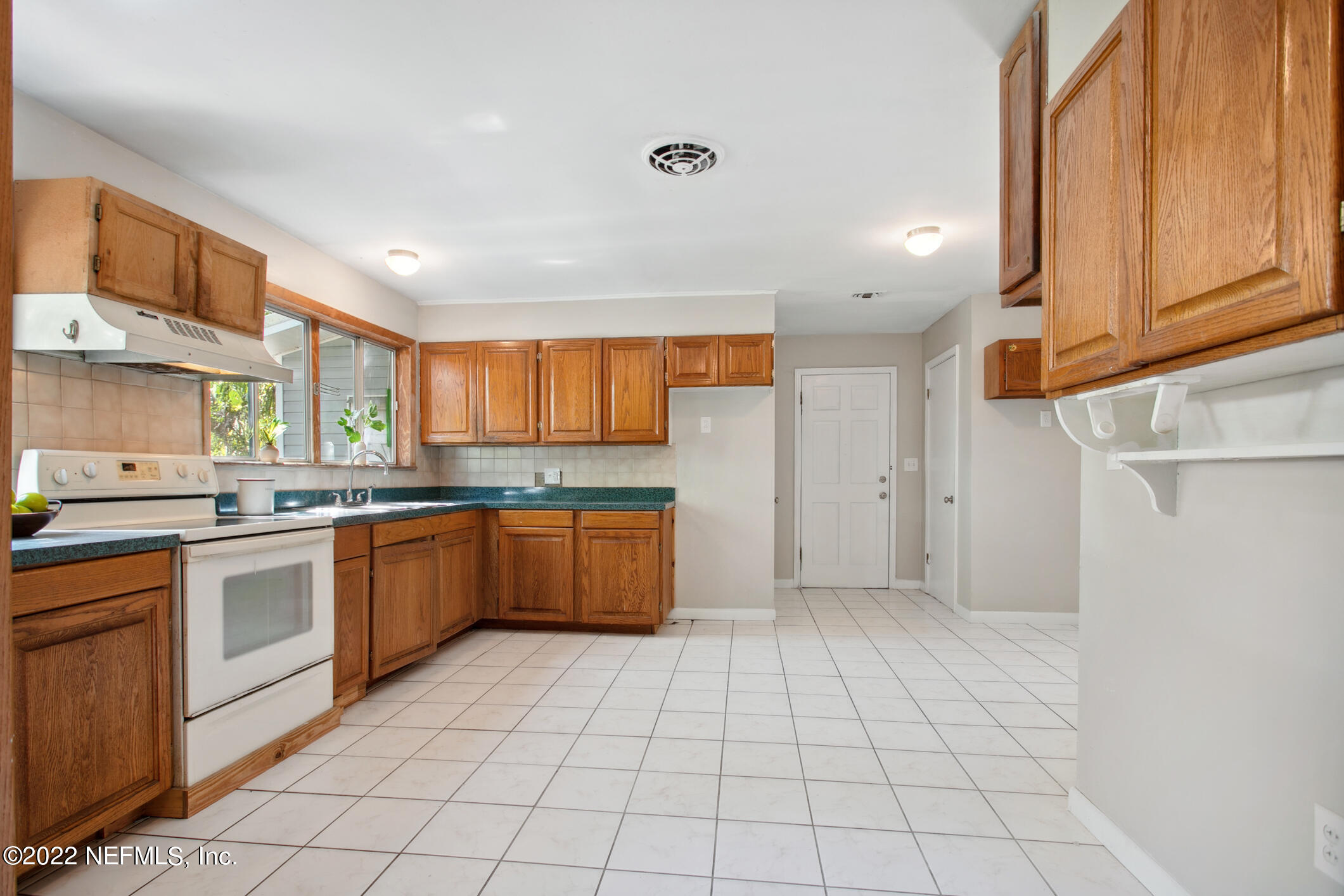 97 Spring Street St. Augustine, FL 32084 - Photo 9 of 18 a large kitchen with a stove a sink dishwasher and a refrigerator