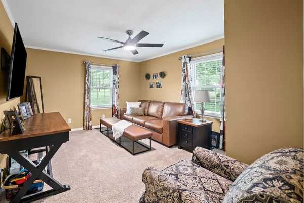 a bedroom with furniture and a window