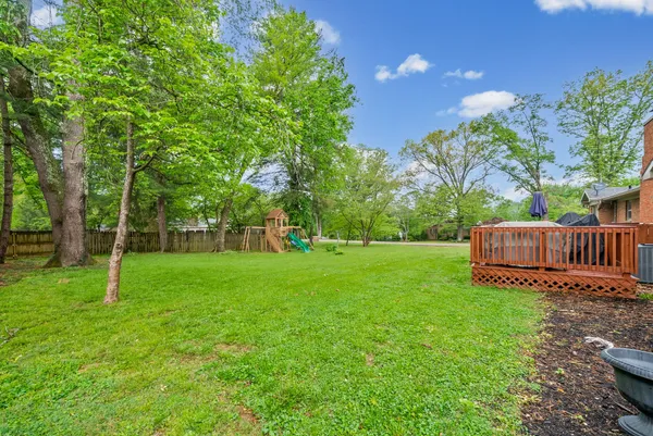 a view of a backyard with a small cabin