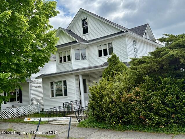 706 Delaware Street Forest City, PA 18421 - Photo 2 of 33 a front view of a house with a garden