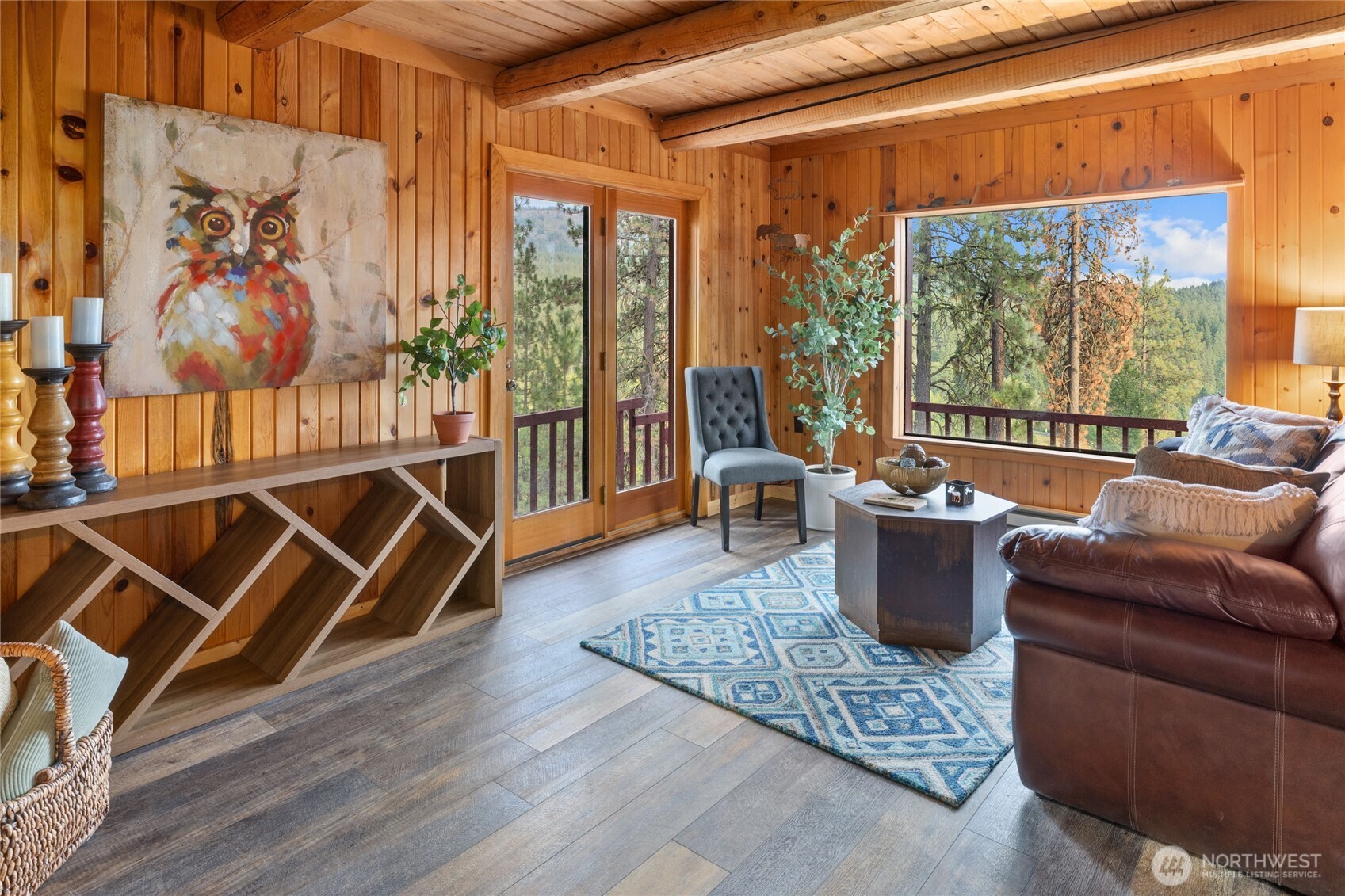 300 Teanaway Ridge Way Cle Elum, WA 98922 - Photo 16 of 38 a living room with furniture a rug and a floor to ceiling window