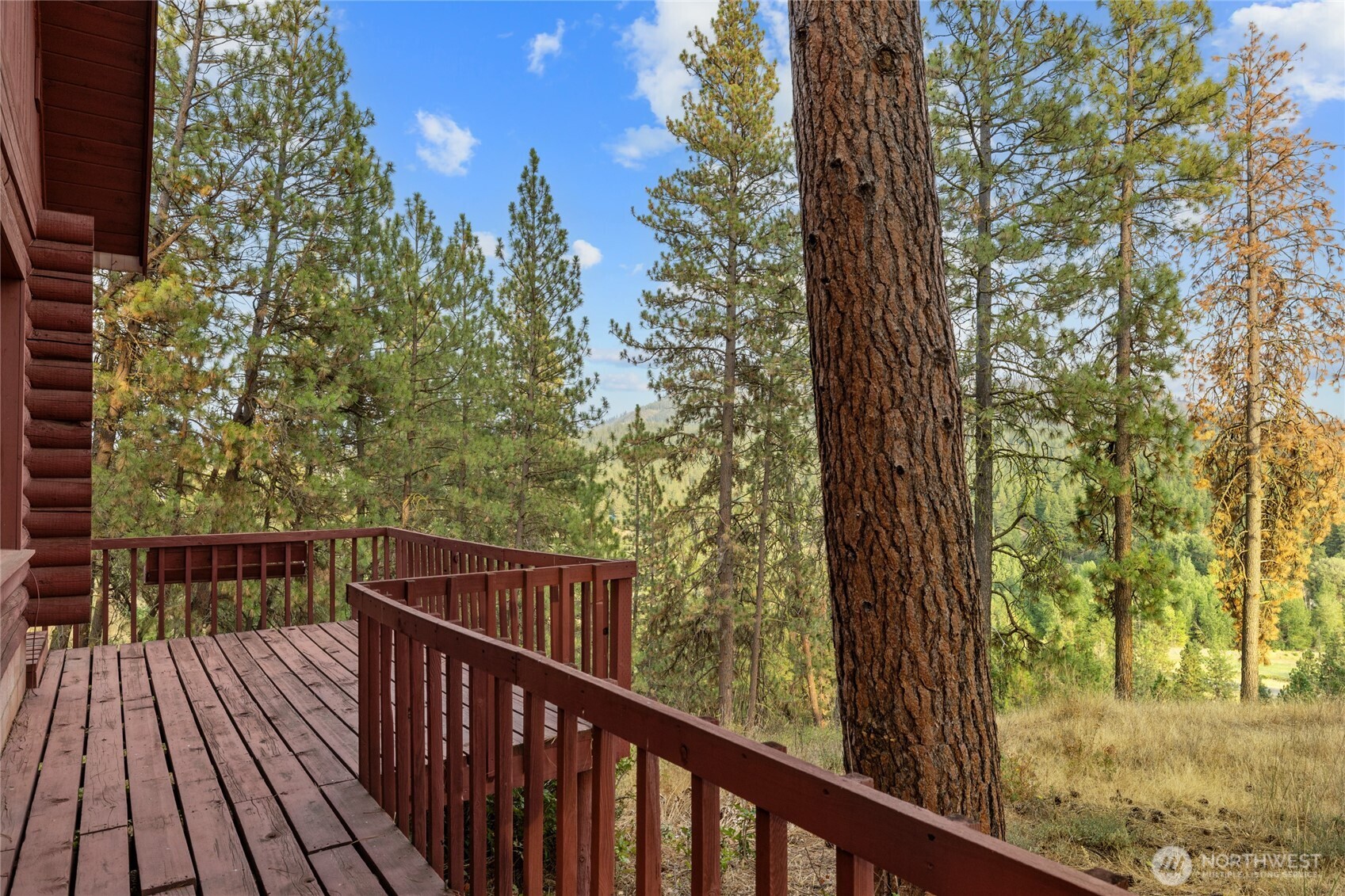 300 Teanaway Ridge Way Cle Elum, WA 98922 - Photo 34 of 38 a view of a balcony with wooden floor and fence