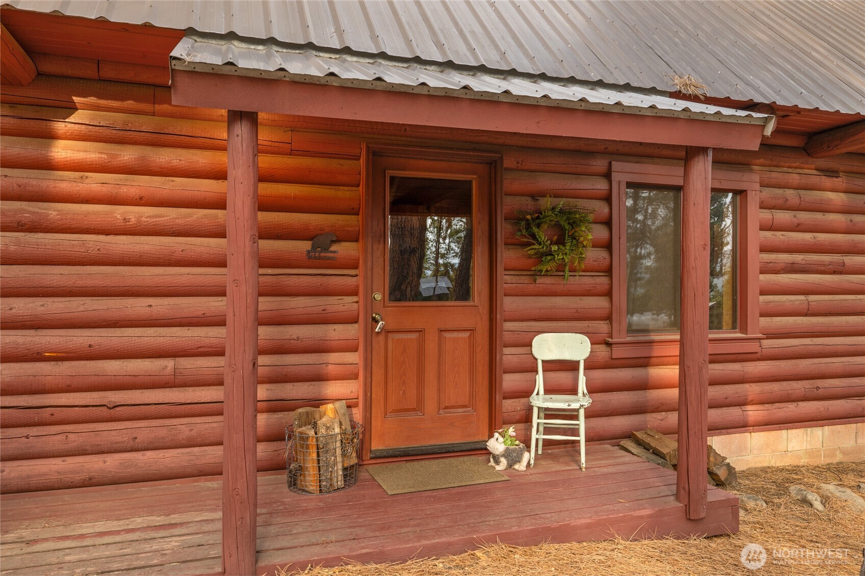 300 Teanaway Ridge Way Cle Elum, WA 98922 - Photo 5 of 38 a view of a wooden door and chair in front of house