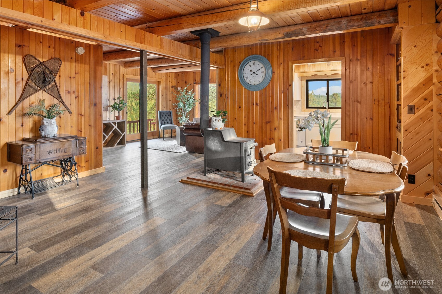 300 Teanaway Ridge Way Cle Elum, WA 98922 - Photo 7 of 38 a dining room with wooden floor a glass table and chairs