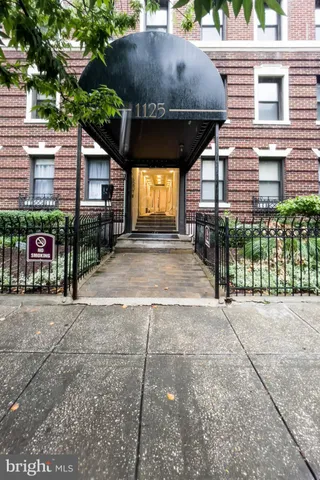 a view of a chairs and table in the back yard