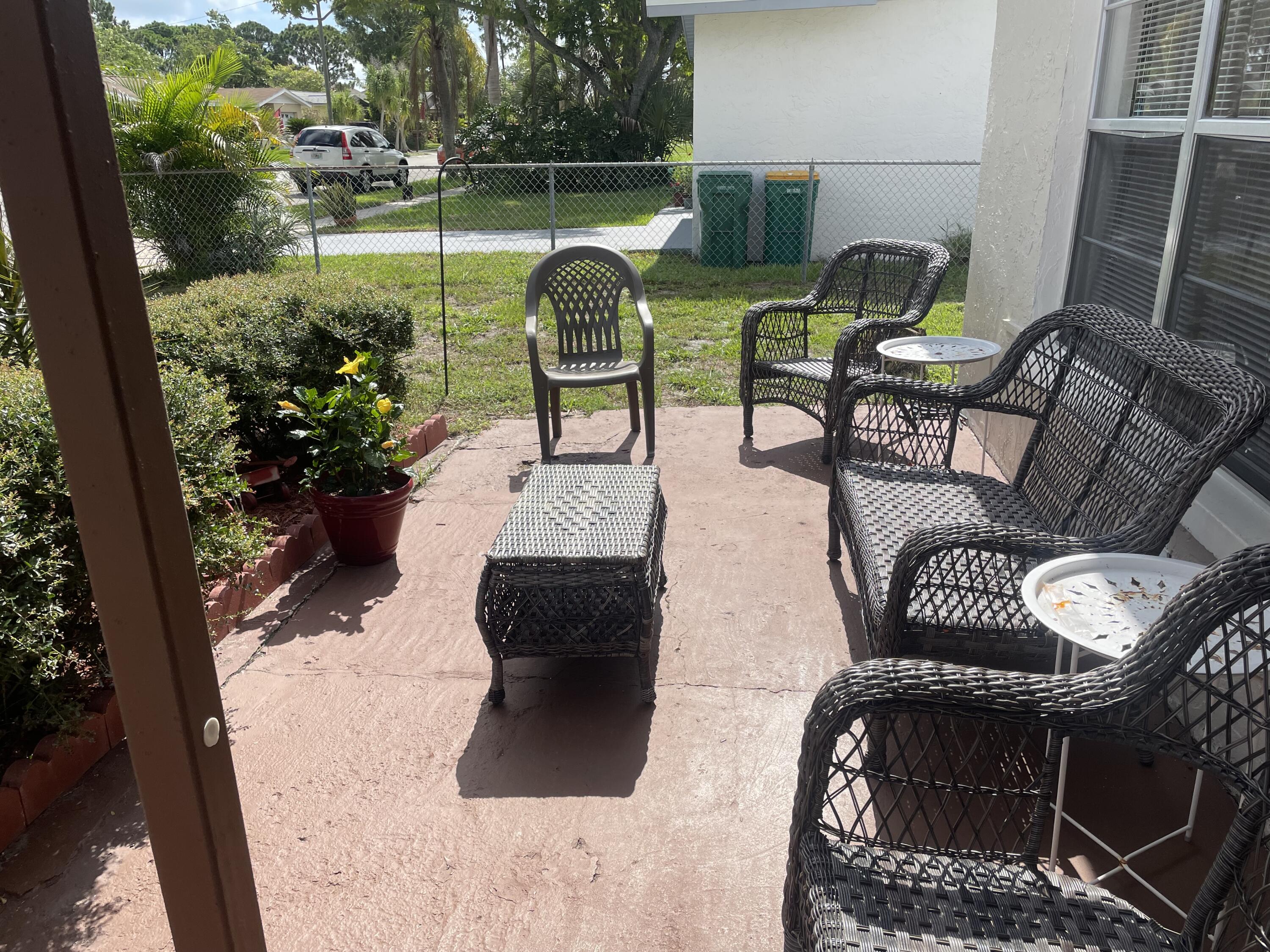427 Count Street Melbourne, FL 32901 - Photo 2 of 9 a view of a chairs and table in patio