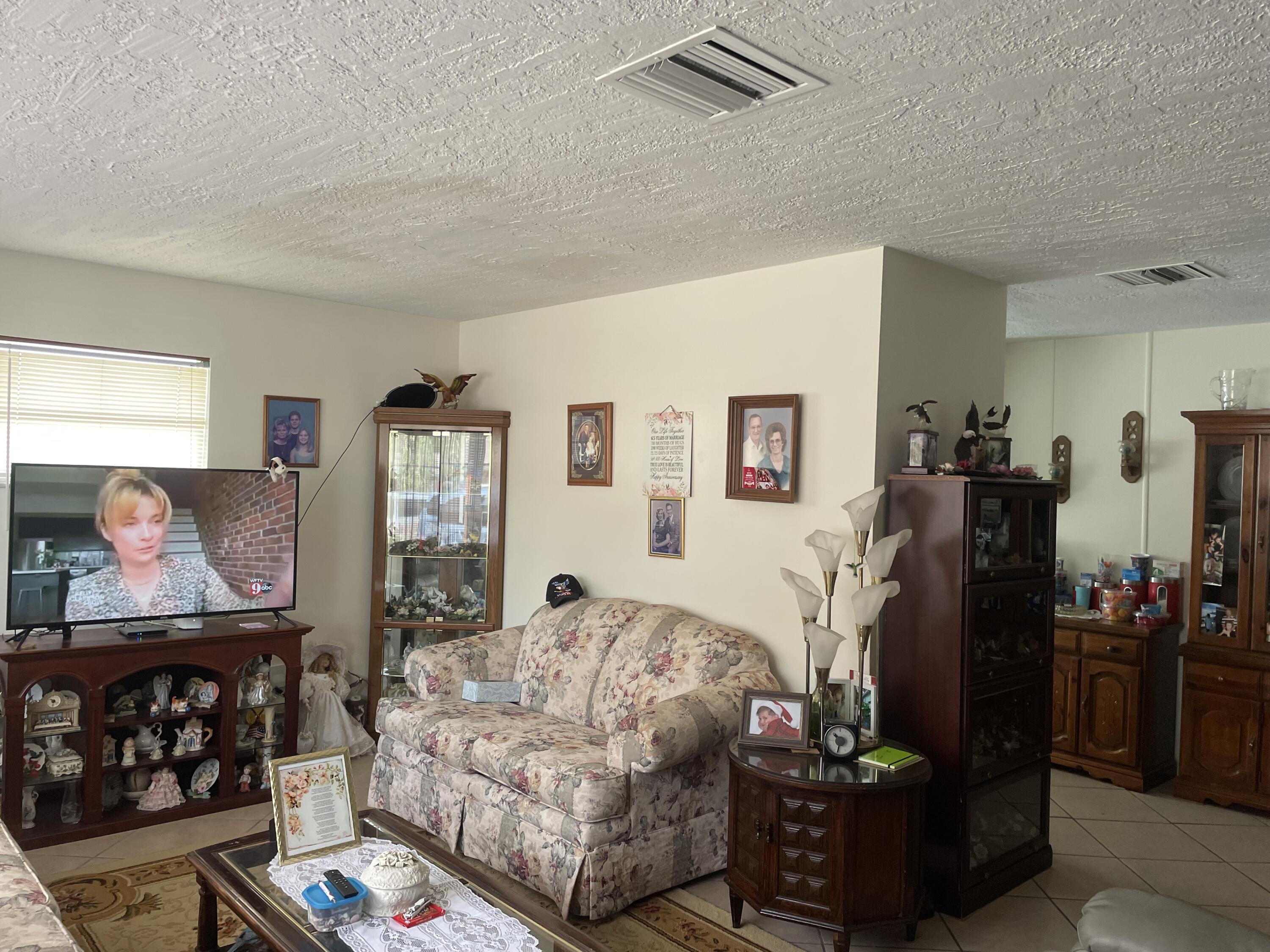 427 Count Street Melbourne, FL 32901 - Photo 3 of 9 a living room with furniture and a flat screen tv
