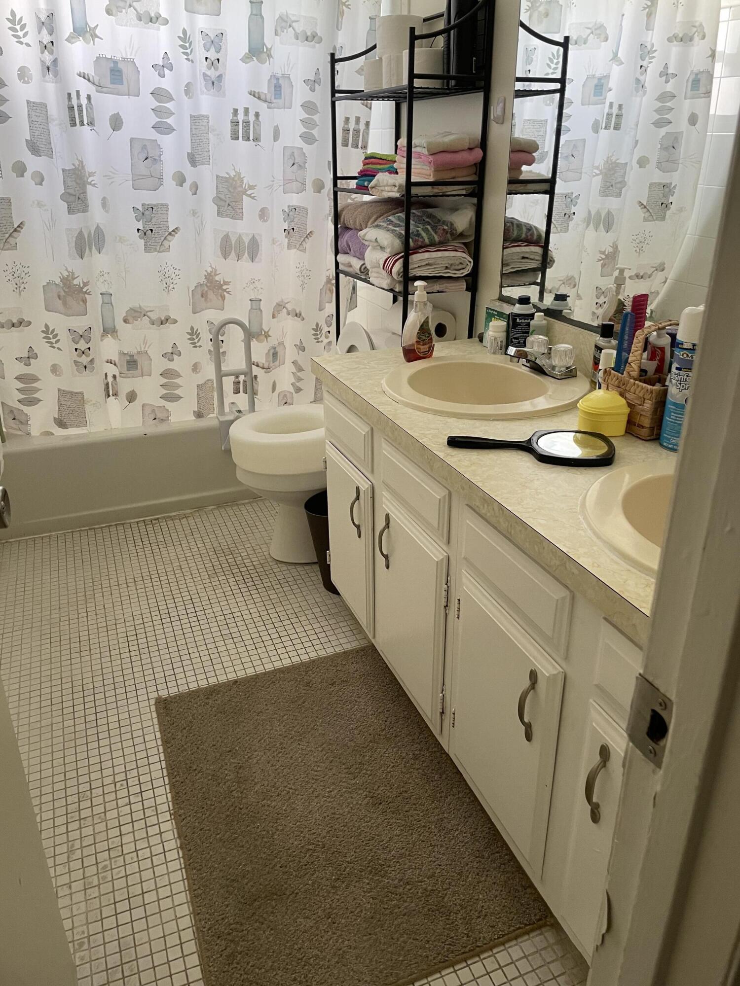 427 Count Street Melbourne, FL 32901 - Photo 6 of 9 a bathroom with a sink a toilet and mirror