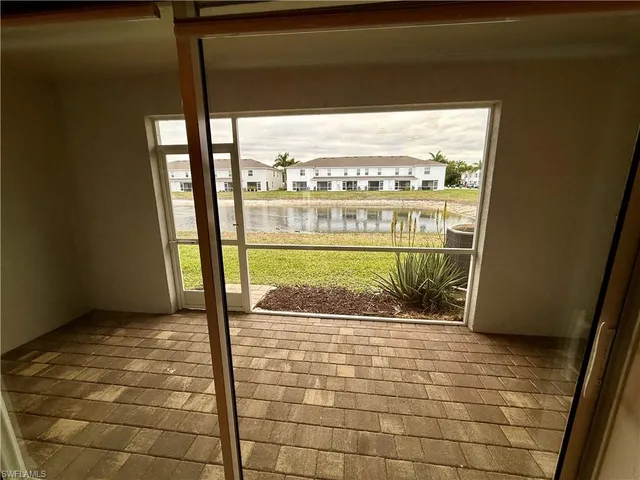 a view of a kitchen with furniture and a ceiling fan