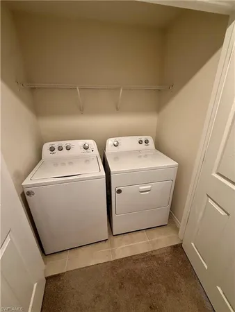 an empty room with a ceiling fan and window