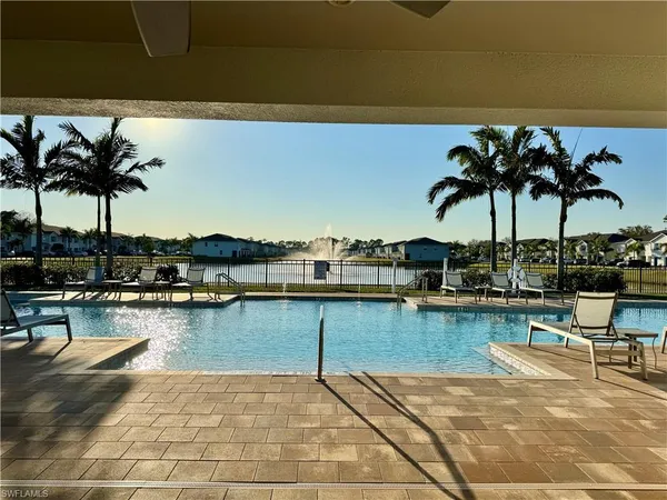 a view of a patio with dining table and chairs