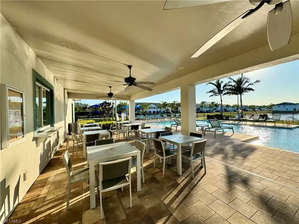 a view of a lake with a table and chairs