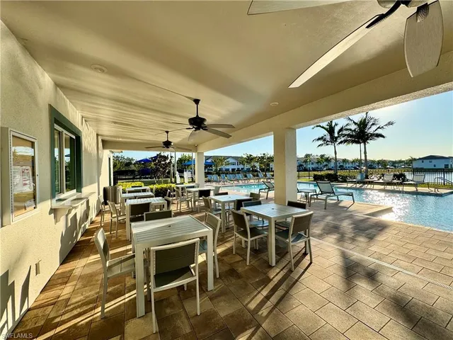 a view of a lake with a table and chairs