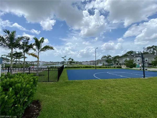 a view of swimming pool with outdoor seating and yard