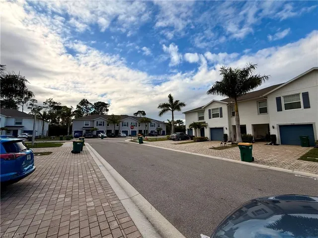 a view of multiple houses with a street