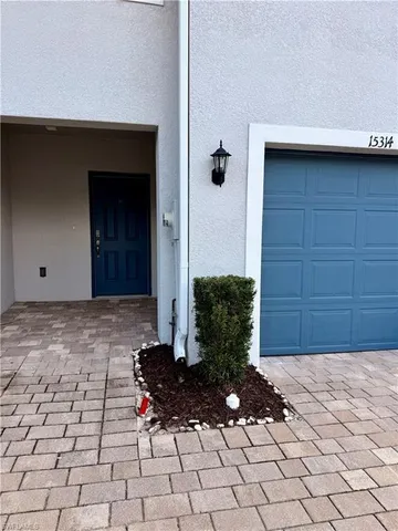a view of a house with a small yard
