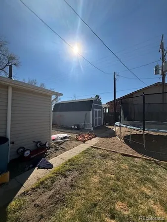 a view of a backyard of a house
