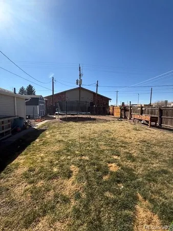 a view of a swimming pool with a yard