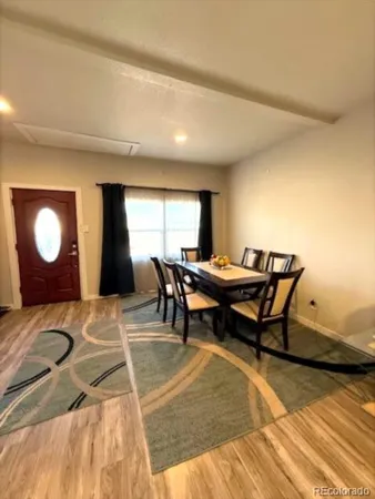 a view of a workspace with furniture and window
