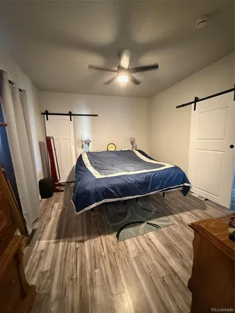 a view of a room with wooden floor