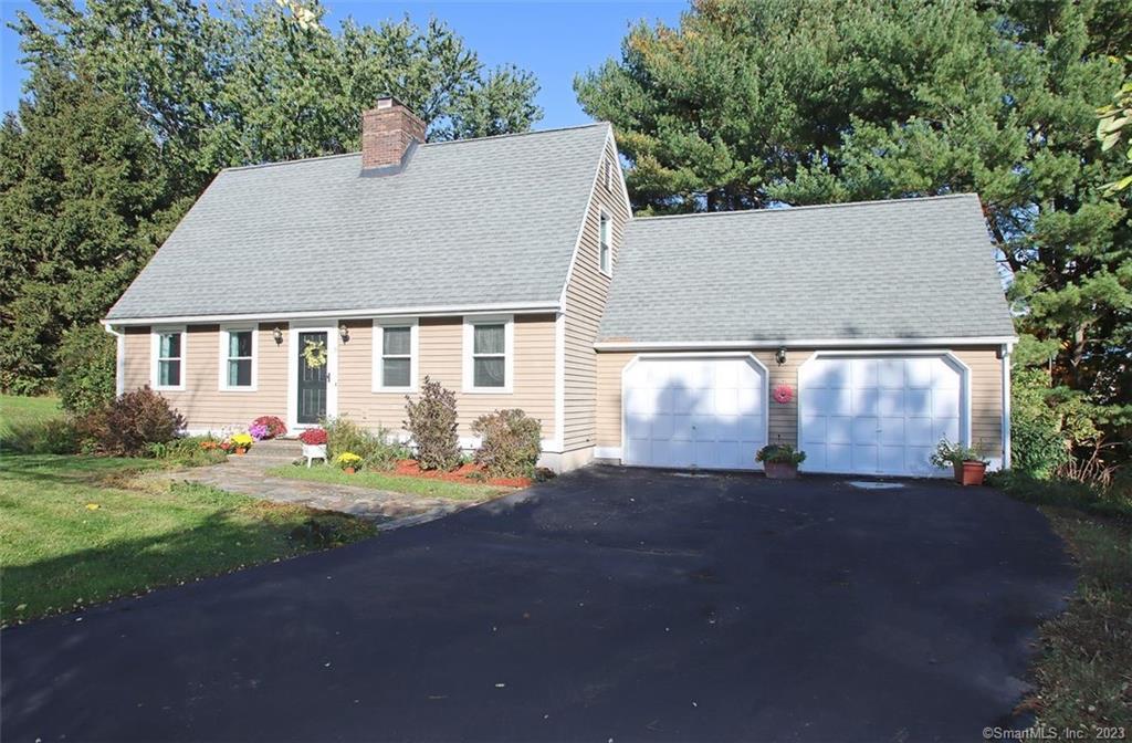 15 Blue Hill Road Middletown, CT 06457 - Photo 1 of 1 a front view of a house with a yard and trees