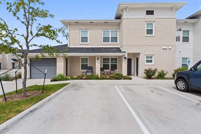 a kitchen with a sink stove and microwave