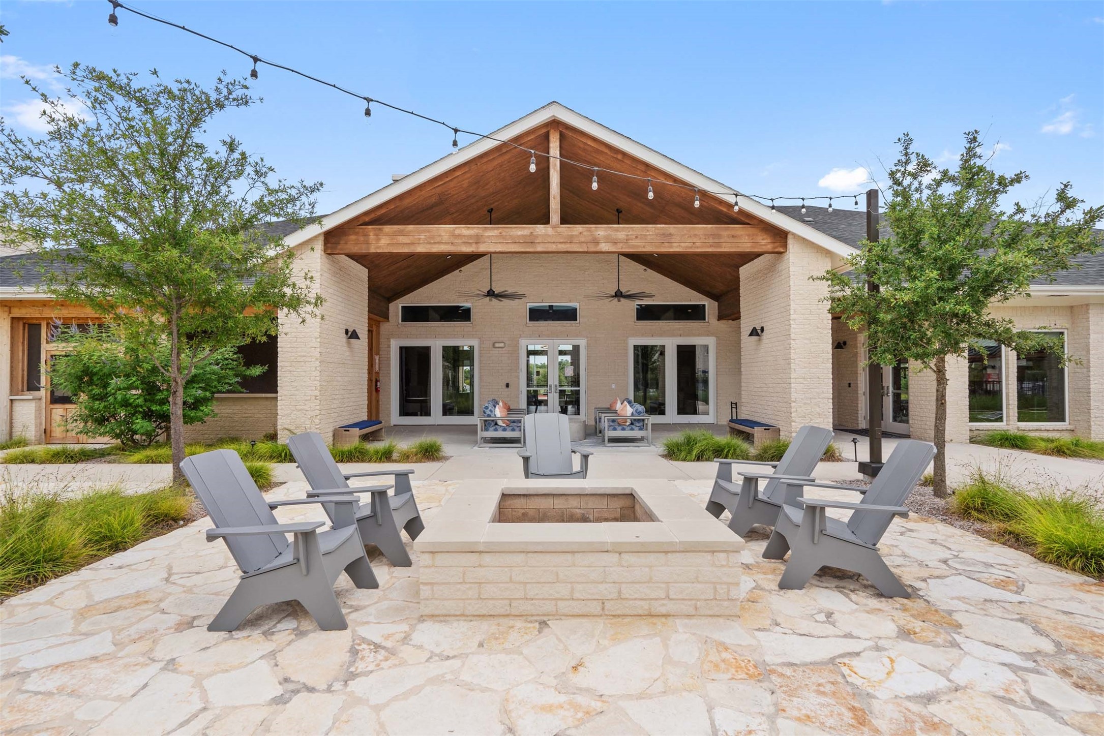 1101 Halsey Drive, Unit 2515 Leander, TX 78641 - Photo 13 of 50 a view of a patio with table and chairs and garden