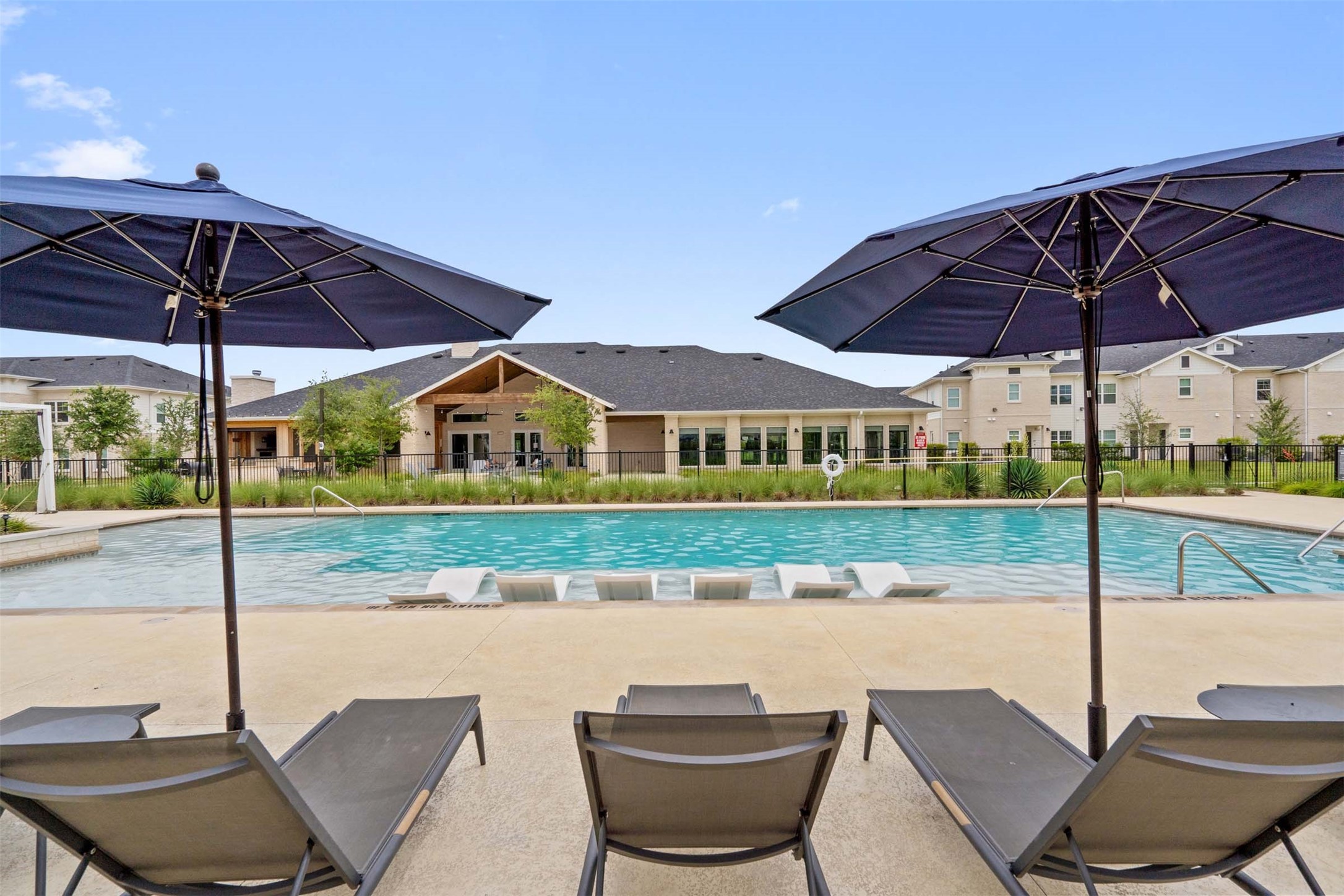 1101 Halsey Drive, Unit 2515 Leander, TX 78641 - Photo 24 of 50 a view of a chair and table in the patio