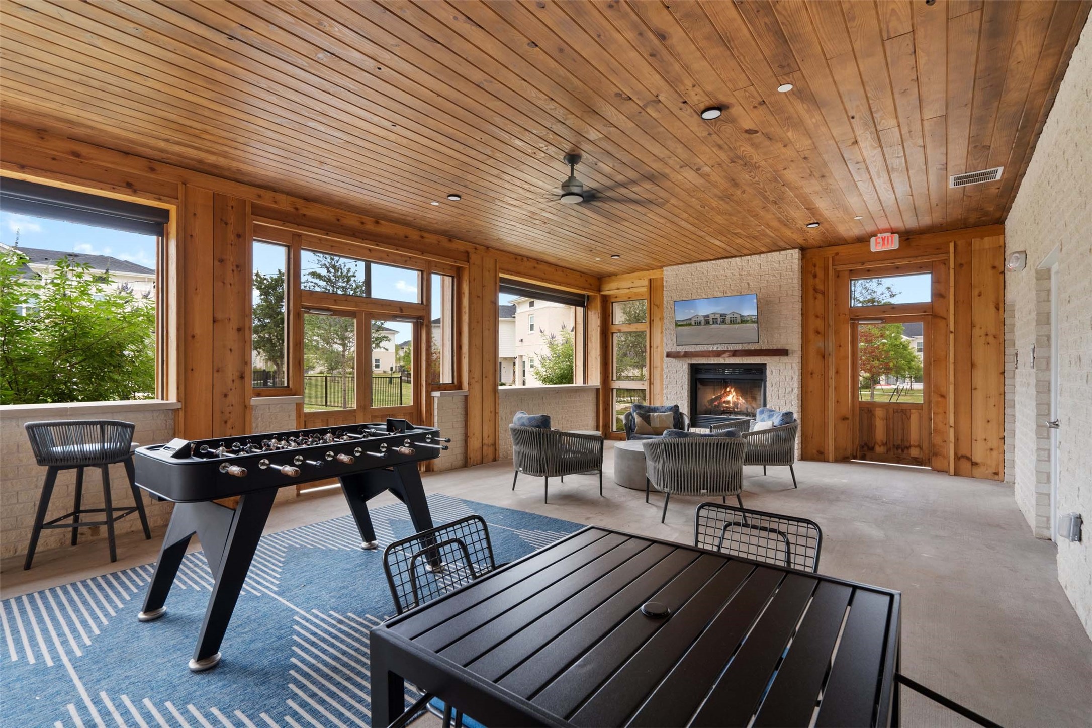 1101 Halsey Drive, Unit 2515 Leander, TX 78641 - Photo 27 of 50 a living room with furniture a fireplace wooden floor and a large window
