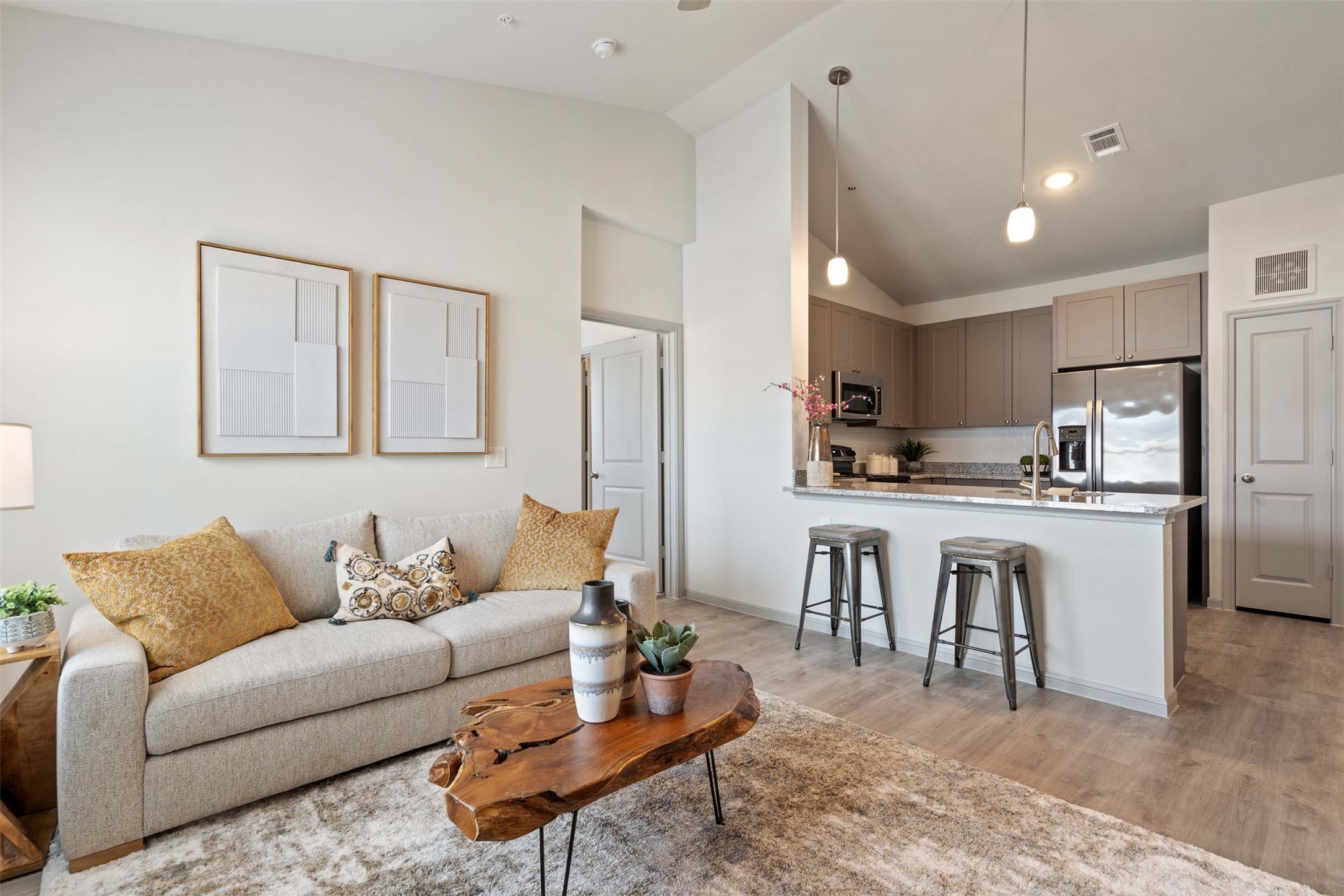 1101 Halsey Drive, Unit 2515 Leander, TX 78641 - Photo 37 of 50 a living room with kitchen island furniture and a kitchen view