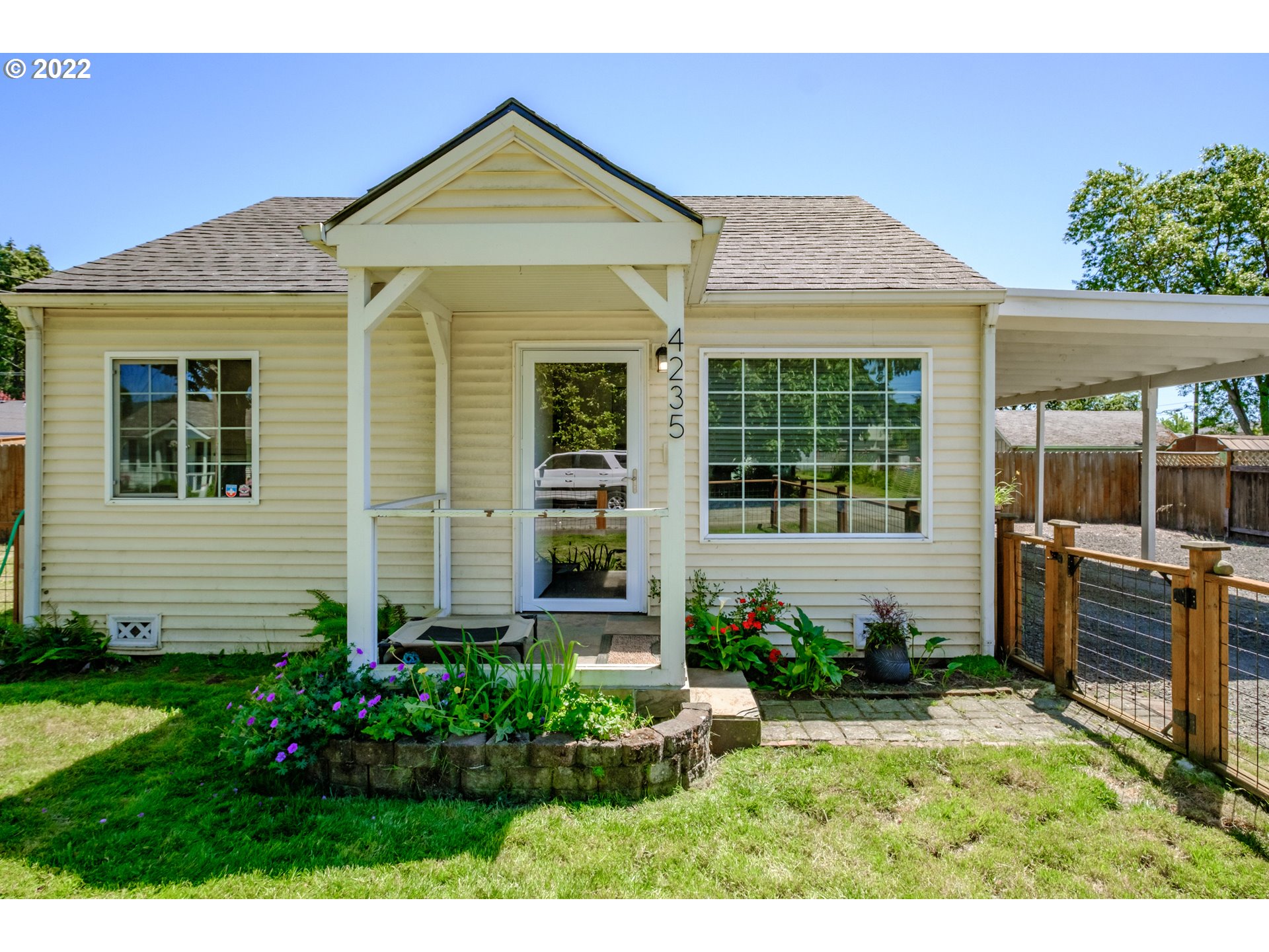 4235 Camellia Street Springfield, OR 97478 - Photo 3 of 27 a front view of a house with garden