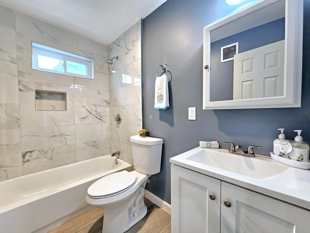 9 Wellington Street Webster, MA 01570 - Photo 14 of 37 a bathroom with a sink a toilet and shower