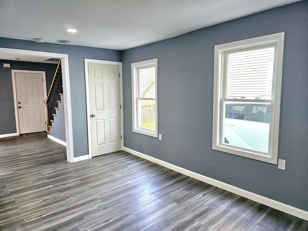 9 Wellington Street Webster, MA 01570 - Photo 15 of 37 a view of an empty room with wooden floor and a window