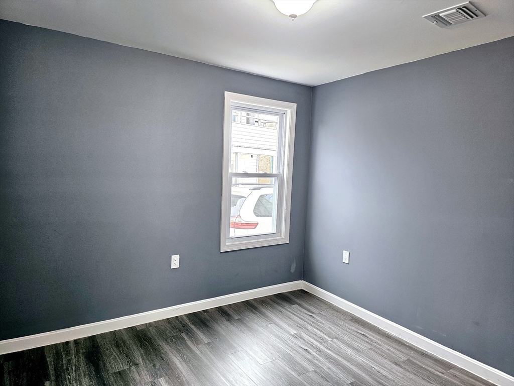 9 Wellington Street Webster, MA 01570 - Photo 16 of 37 a view of an empty room and window