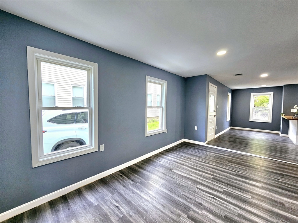 9 Wellington Street Webster, MA 01570 - Photo 17 of 37 a view of an empty room with window and wooden floor