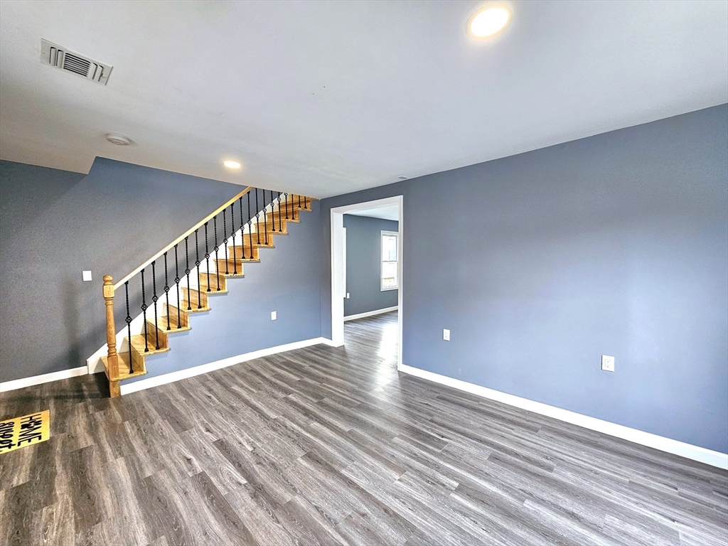 9 Wellington Street Webster, MA 01570 - Photo 18 of 37 a view of a hallway with wooden floor