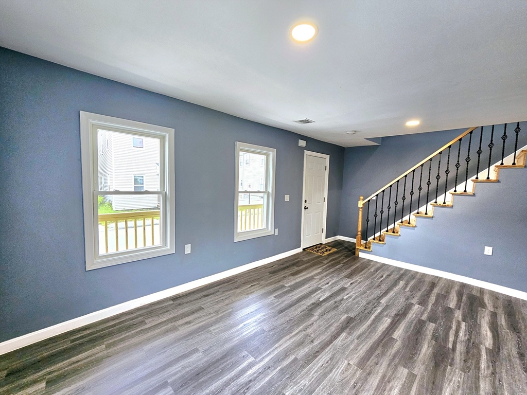 9 Wellington Street Webster, MA 01570 - Photo 19 of 37 a view of an empty room with wooden floor and a window