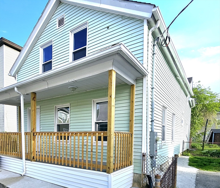 9 Wellington Street Webster, MA 01570 - Photo 23 of 37 a view of a house with a deck