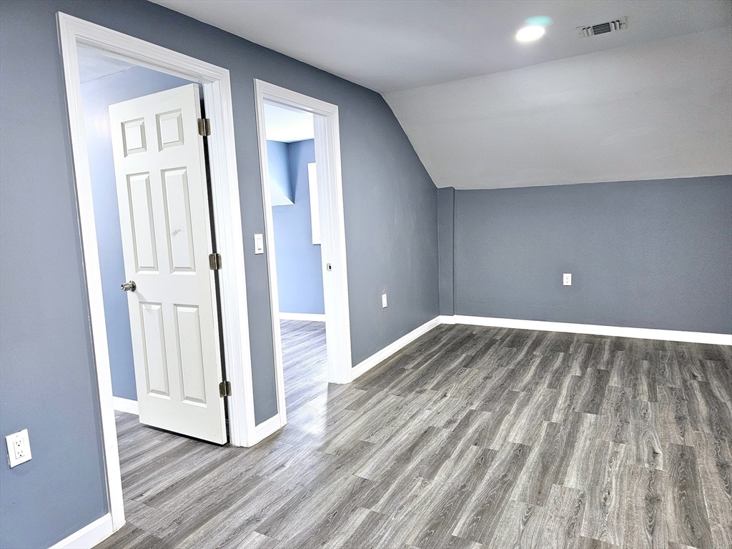 9 Wellington Street Webster, MA 01570 - Photo 30 of 37 a view of empty room with wooden floor