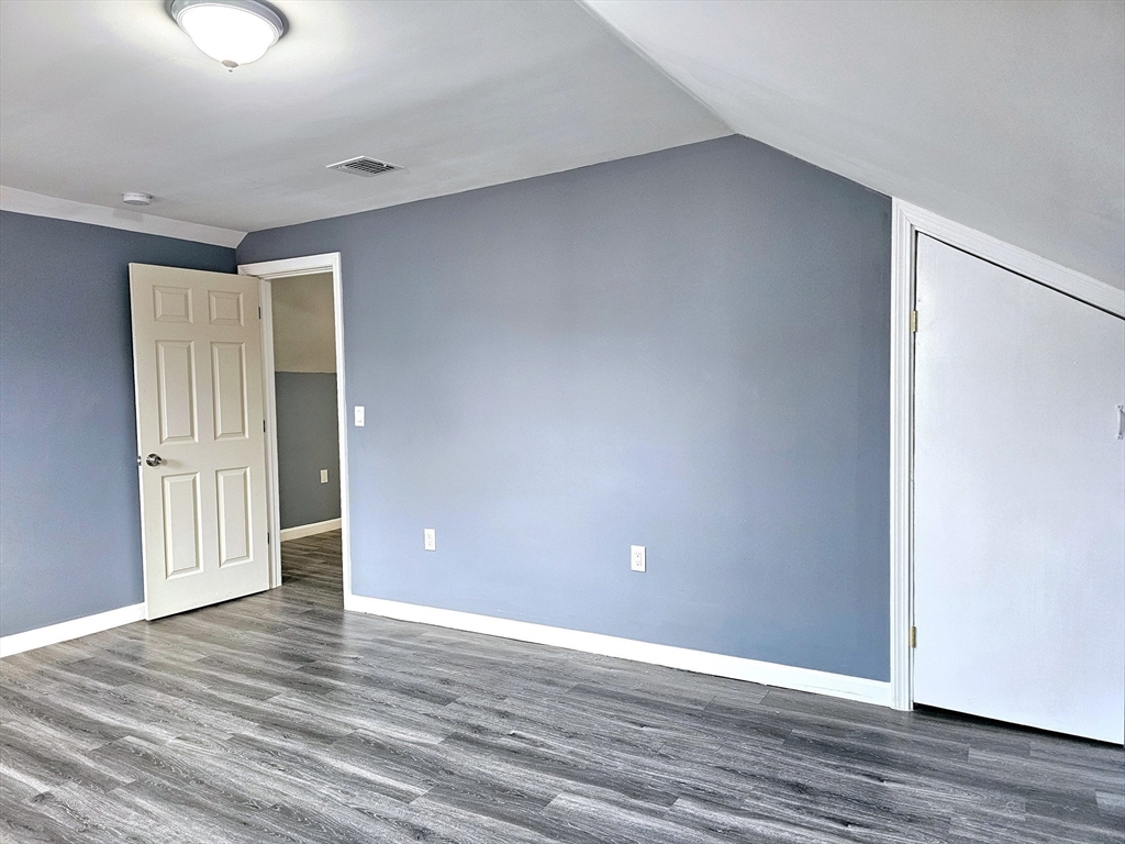 9 Wellington Street Webster, MA 01570 - Photo 31 of 37 a view of an empty room with wooden floor and closet