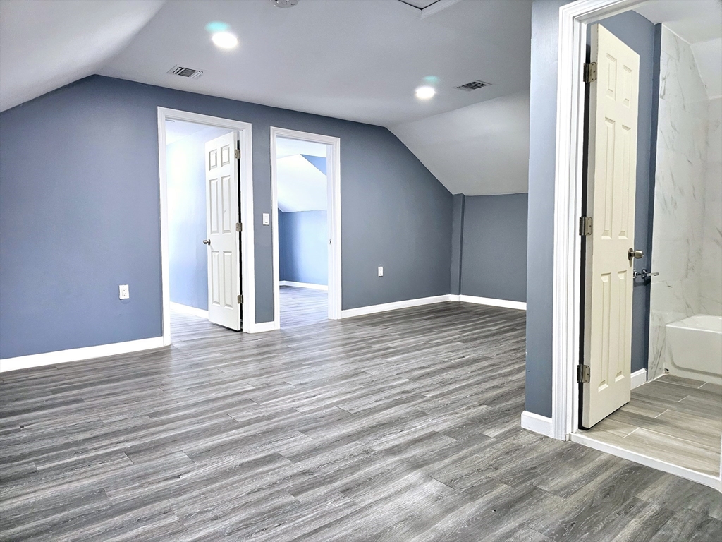 9 Wellington Street Webster, MA 01570 - Photo 33 of 37 an empty room with wooden floor and windows