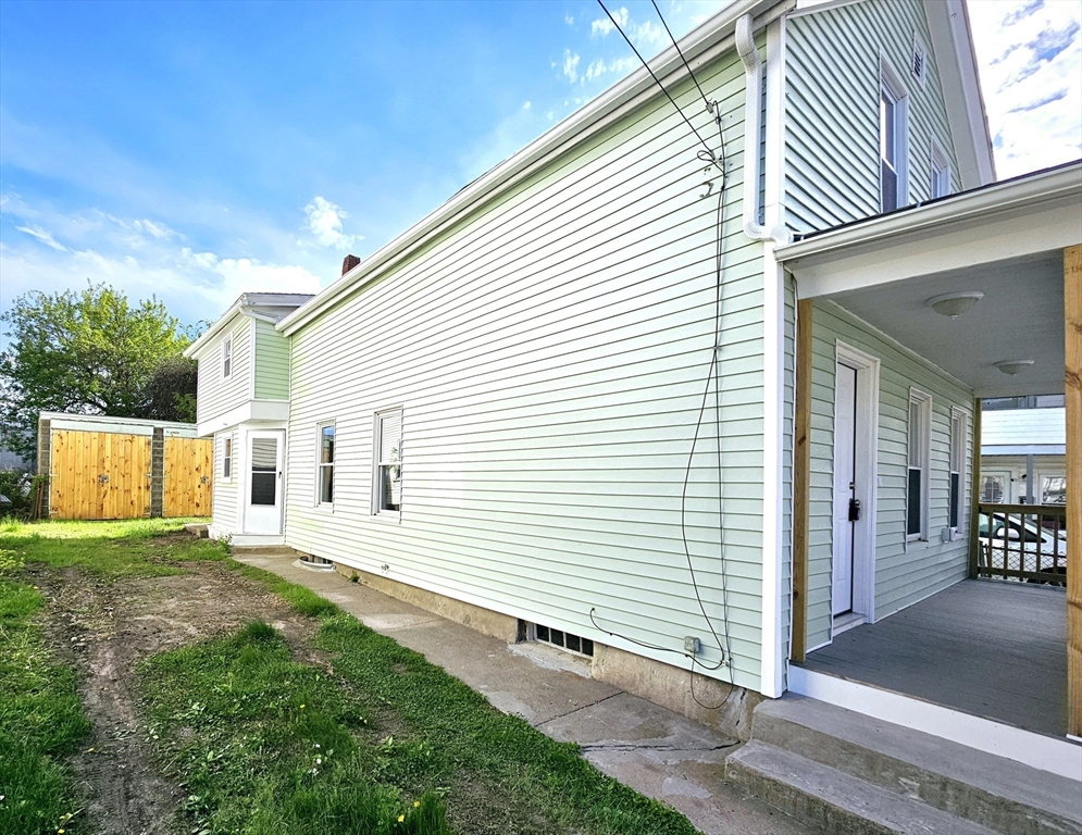 9 Wellington Street Webster, MA 01570 - Photo 36 of 37 a view of a house with a yard