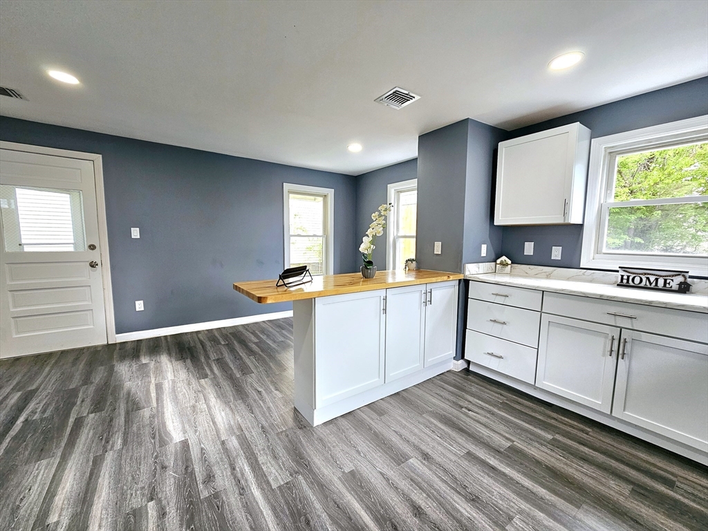 9 Wellington Street Webster, MA 01570 - Photo 7 of 37 a kitchen with a sink window and cabinets