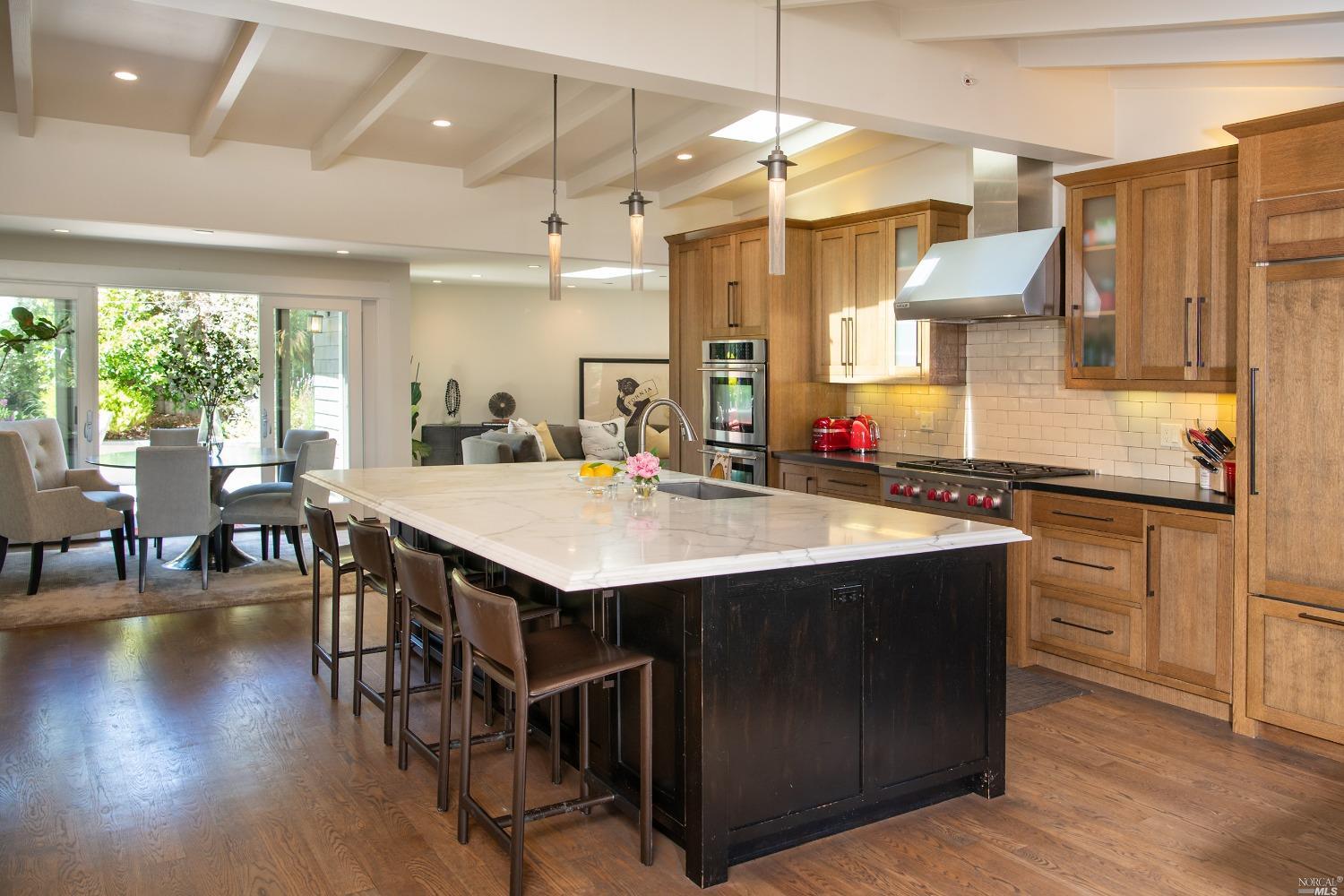 208 Reed Boulevard Mill Valley, CA 94941 - Photo 5 of 47 The huge, open kitchen welcomes all guests and invites them to have a seat at the marble island.