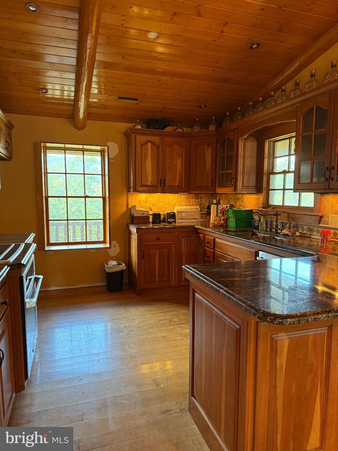 4520 St Davids Church Road Fort Valley, VA 22652 - Photo 4 of 6 a kitchen with stainless steel appliances granite countertop a sink stove and cabinets