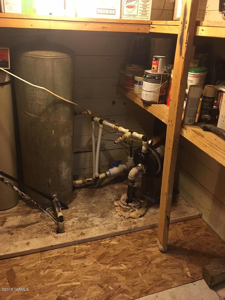590 Hudson Road Granger, WA 98932 - Photo 17 of 26 a room with water heater and storage
