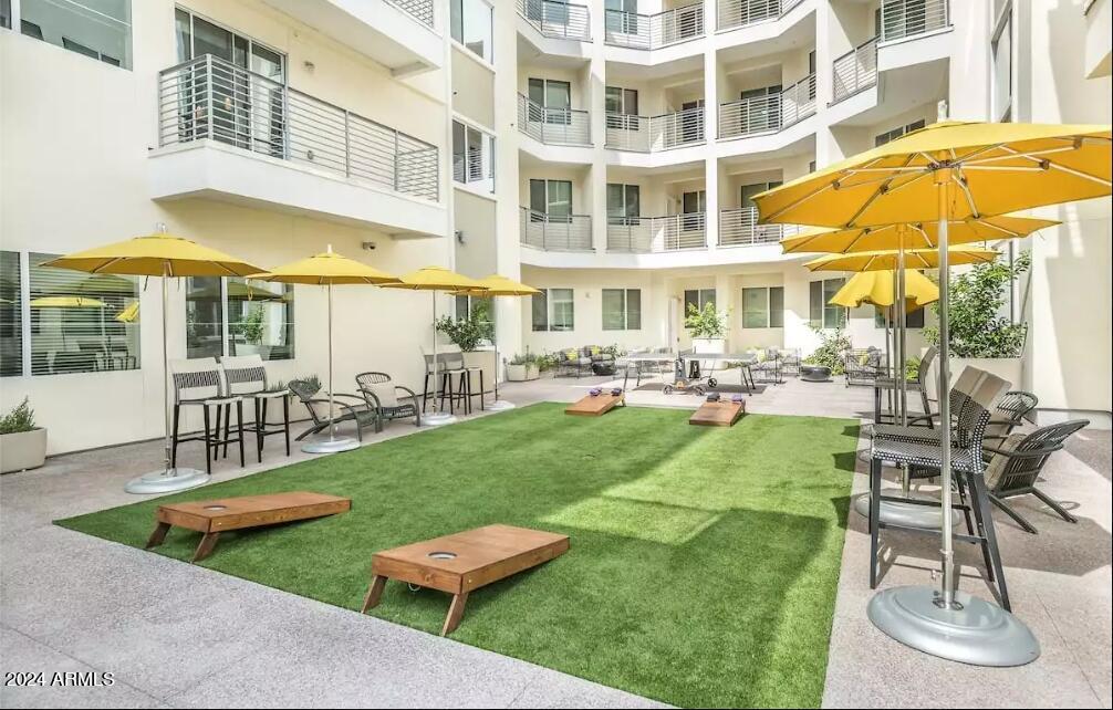 4949 North 7th Street, Unit A3 Phoenix, AZ 85014 - Photo 21 of 22 a view of a house with swimming pool and sitting area
