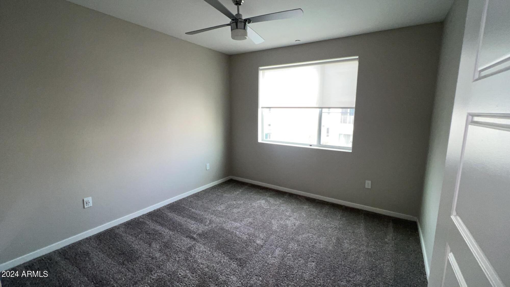 4949 North 7th Street, Unit A3 Phoenix, AZ 85014 - Photo 4 of 22 an empty room with a window