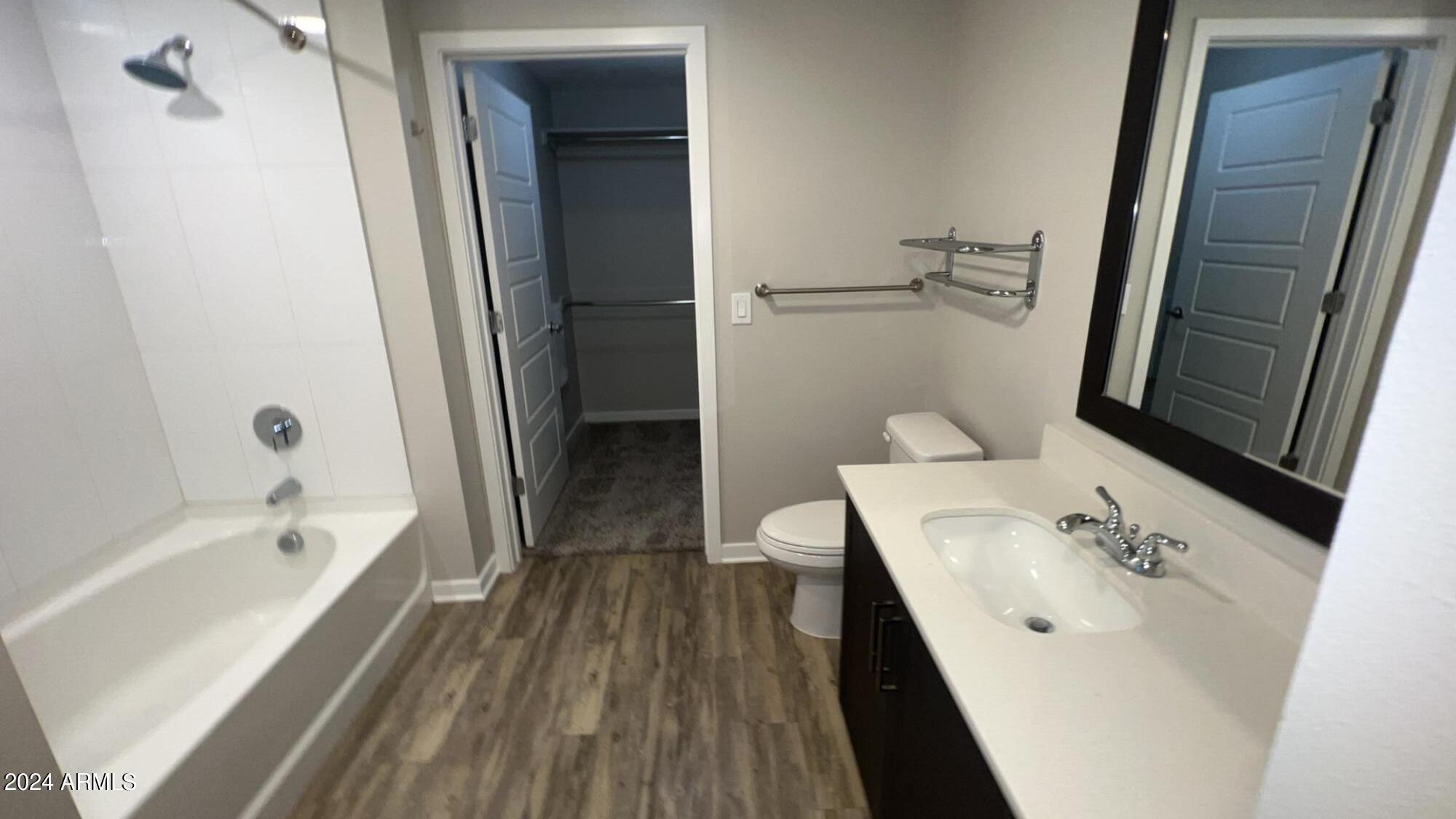 4949 North 7th Street, Unit A3 Phoenix, AZ 85014 - Photo 5 of 22 a bathroom with a sink a mirror and a bathtub